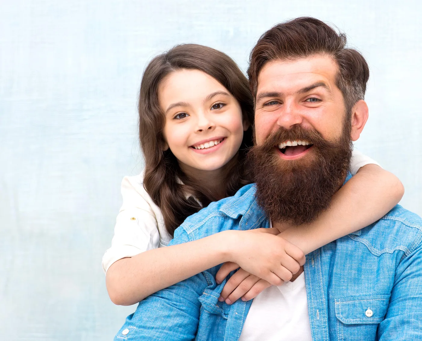 Smiling father and daughter